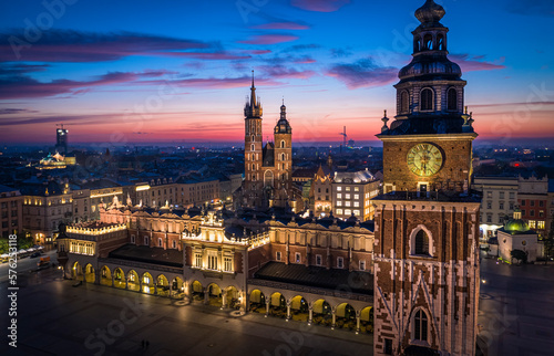 Panorama of Main Square (Saint Mary's Basilica, Sukiennice - Town Hall, Town Hall Tower) in Krakow during magic dawn, Poland photo