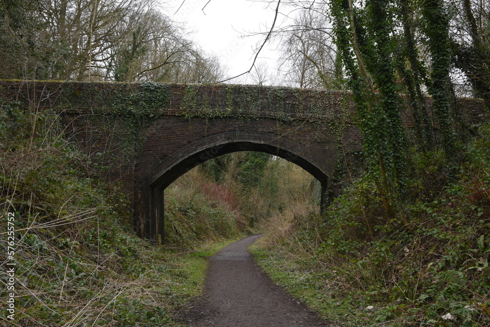 a bridge crossing what used to be the railway at Ironbridge in Shropshire what is now a cycle path 