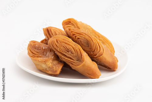 Indian Madatha Thumb Khaja Also Called Gottam Kaja, Badusha, Chirote, Kakinada Kaaja Is Traditional Layered Sweet Puff Pastry Famous In Andhra, Bengal, Gujrat, Bihar, Agra, Odisha, Orrisa In India photo