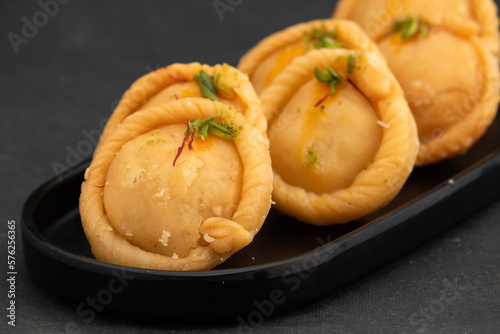 Chandrakala Gujia Mithai Also Called Suryakala Gujiya, Pirukiya, Pirukia, Pedakiya, Karanji, Basundi Gughra Made Of Suji Ghee Stuffed With Mawa Khoya Chasni Mava Khoa For Deepawali, Teez, Holi, Teej photo