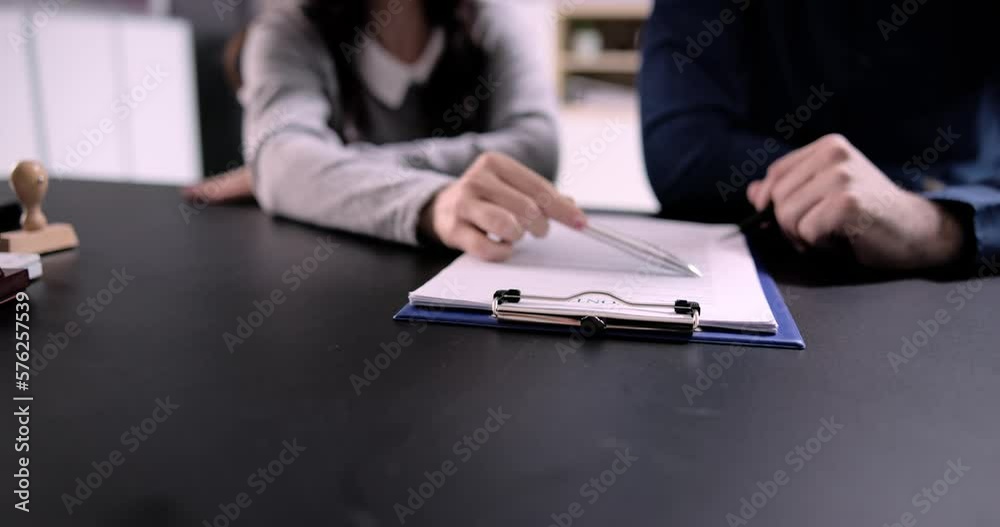 Two Businesspeople Hand Analyzing Document Over Glass Two Businesspeople Hand Analyzing Document Over Glass