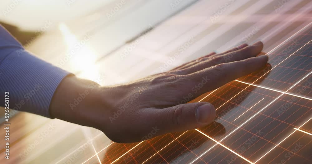 Close Up on Hand Of Professional Maintenance Engineer Touching Industrial Solar Panel Generating Electricity. VFX Graphics Animation Visualizing Energy Being Generated. Green Energy Concept.