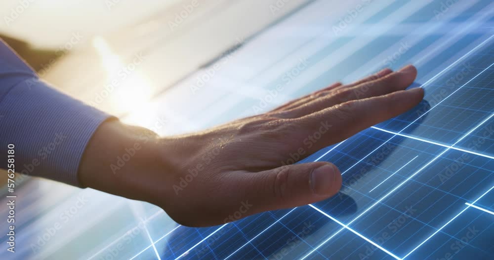 Close Up on Hand Of Professional Maintenance Engineer Touching Industrial Solar Panel Generating Electricity. VFX Graphics Animation Visualizing Energy Being Generated. Sustainable Energy Concept.