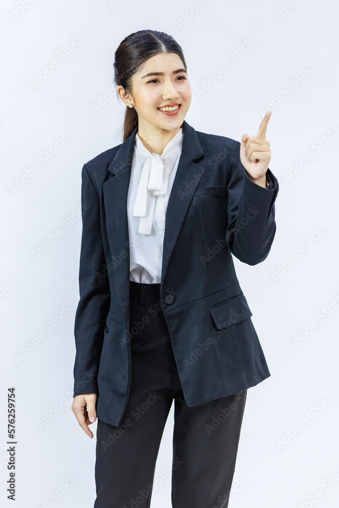 Portrait isolated cutout studio shot Millennial Asian professional successful female businesswoman in formal business suit pants standing smiling holding hand presenting product on white background Portrait isolated cutout studio shot Millennial Asian professional successful female businesswoman in formal business suit pants standing smiling holding hand presenting product on white background
