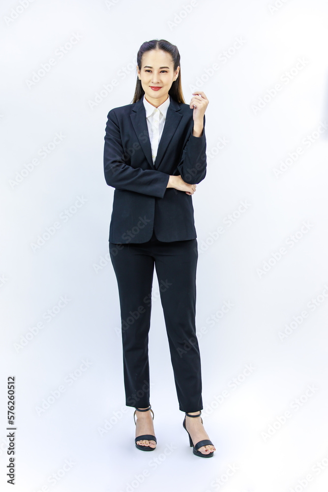Portrait isolated cutout studio full body shot of Millennial Asian professional successful female businesswoman lawyer ceo in formal business suit holding hands crossed arms on white background Portrait isolated cutout studio full body shot of Millennial Asian professional successful female businesswoman lawyer ceo in formal business suit holding hands crossed arms on white background