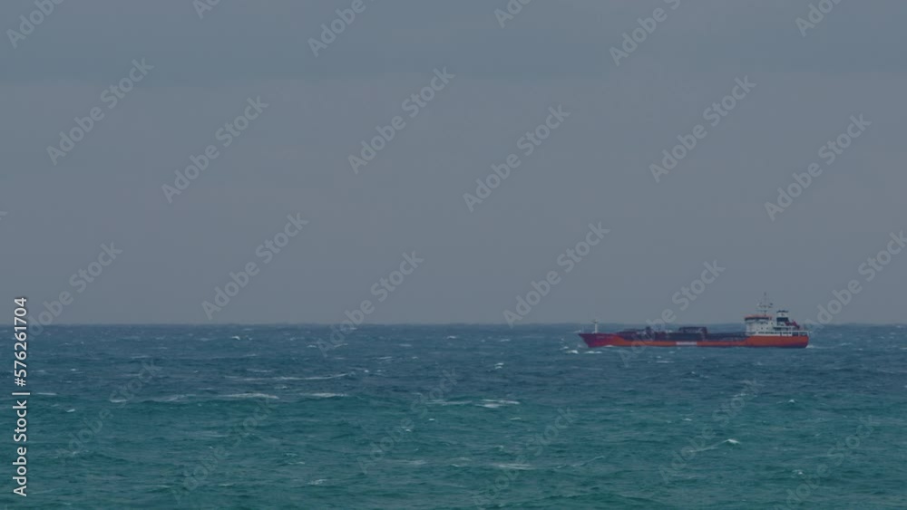 Cargo ship crash into stormy ocean waves during transport Cargo ship crash into stormy ocean waves during transport