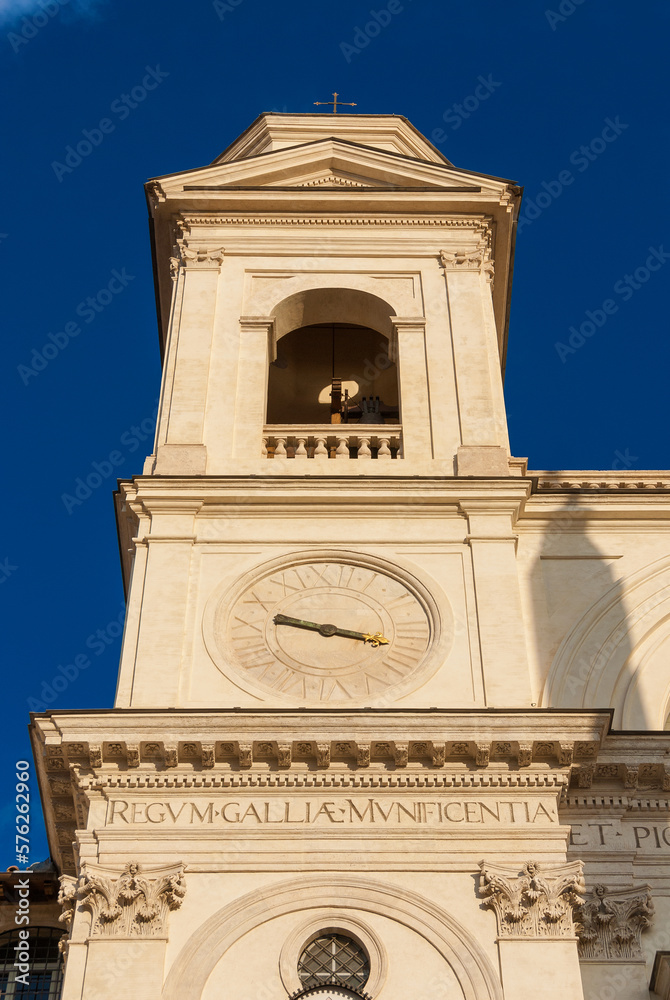 Fototapeta premium Religious architecture in Rome.Twin bell tower with clock of Trinità dei Monti renaissance church, at the top of famous Spanish Steps