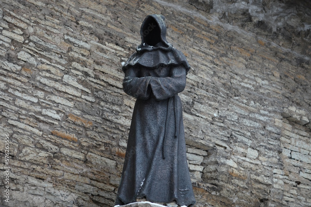 Sculpture monument of the medieval monk Sculpture monument of the medieval monk