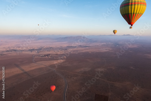 Top view of hot air balloons flying over the desert near Marrakech 