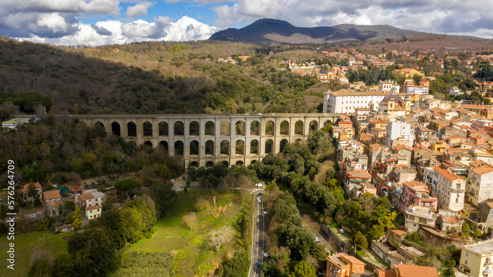 Aerial view of the monumental bridge and viaduct of Ariccia, Italy. It is a little city of Castelli Romani, in the metropolitan area of Rome. On the right the Old Town of Ariccia.