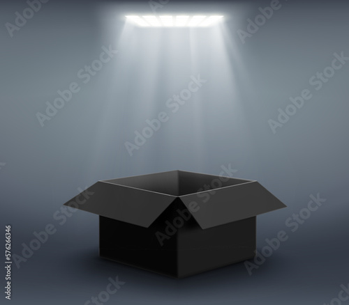 Vector open black cardboard box illuminated by a spotlight.