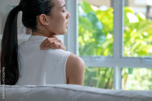 Asian woman has shoulder pain. Female holding painful shoulder with another hand. People with body-muscles problem, Healthcare And Medicine. Free Download Asian woman has shoulder pain. Female holding painful shoulder with another hand. People with body-muscles problem, Healthcare And Medicine. - GFXLoad