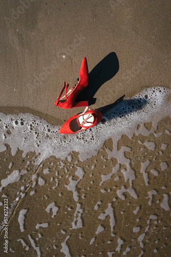 Wallpaper Mural Red high heels  with retro style abandoned in a seashore near the sea Torontodigital.ca