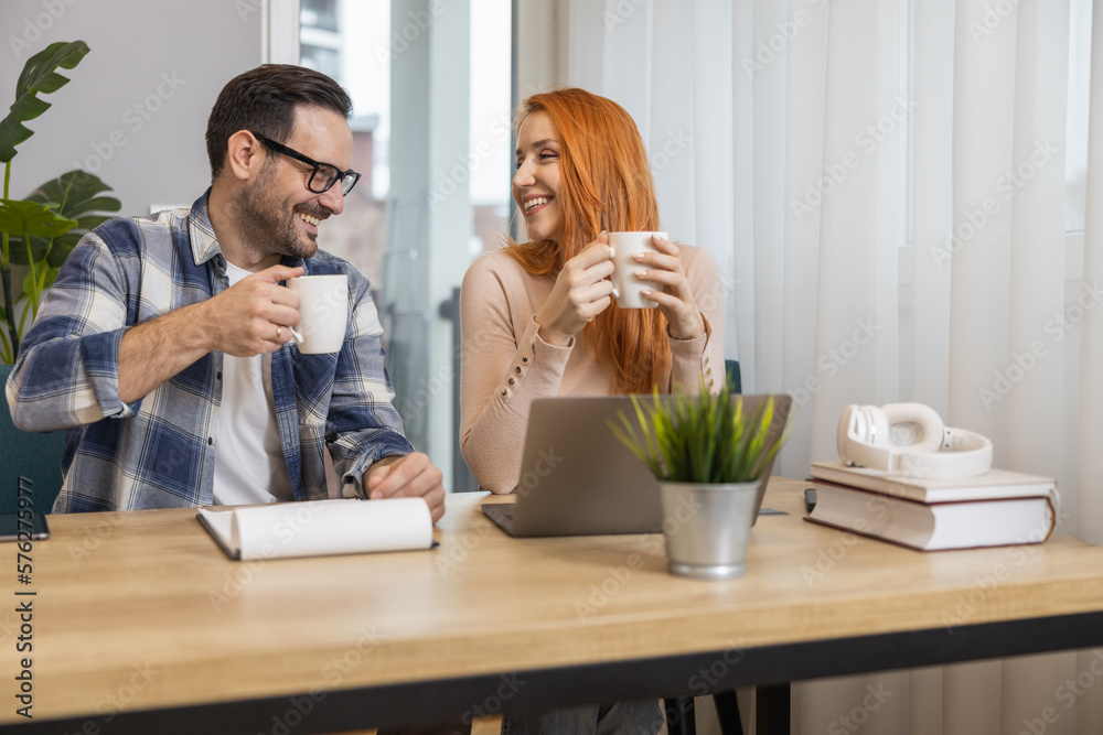 Successful business couple working together in home office Successful business couple working together in home office