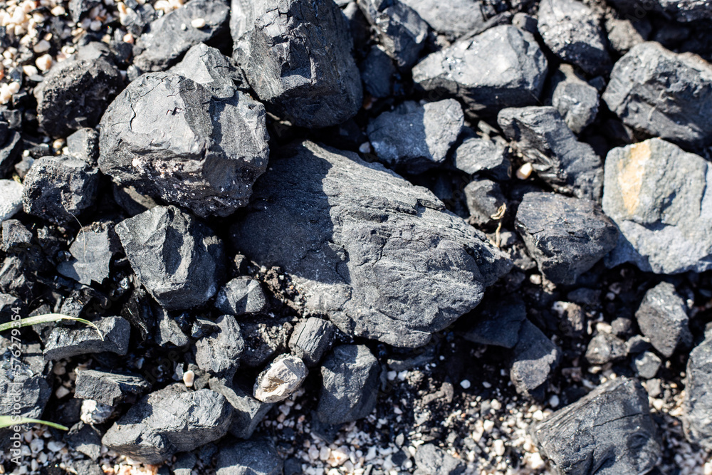 Black coal stones abstract textured background 