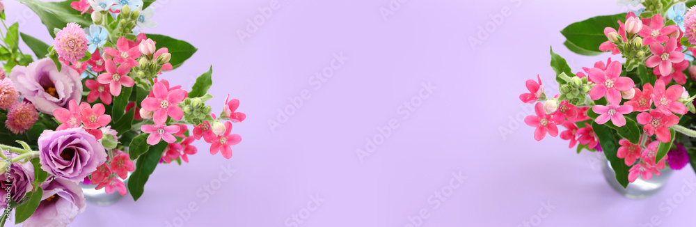 Top view image of pink and purple flowers composition over pastel background