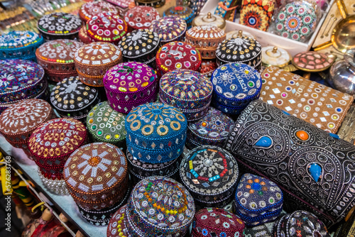 Colorful little boxes covered with stones in a shop in a souk in Marrakech.