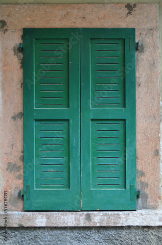 Close Up of Window with Closed Green Wooden Shutters in Old Italian Building   © eyepals