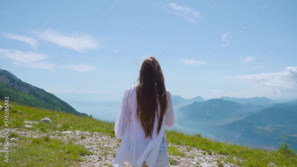 Garda lake from monte baldo with a young girl
