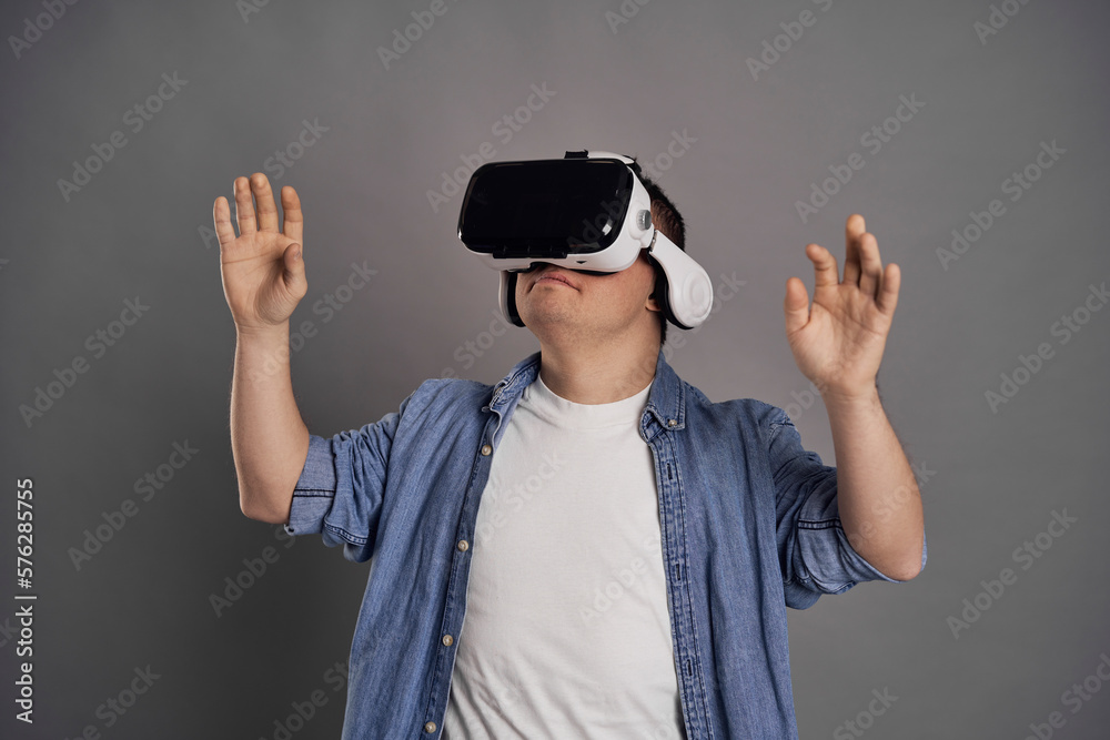 Man with down syndrome wearing VR glasses Man with down syndrome wearing VR glasses