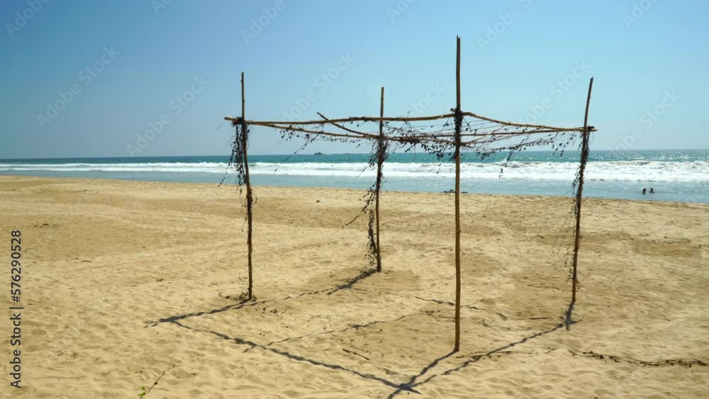 Collapsed awning of bamboo on the beach Collapsed awning of bamboo on the beach