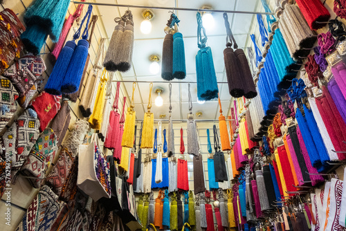 colorful typical curtain tassels hanging in a shop in a souk in marrakech © Alessandro Vecchi