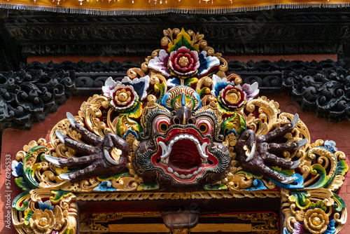 Colorful mask over the entrance  to the temple in Nusa Dua, Bali, Indonesia. photo