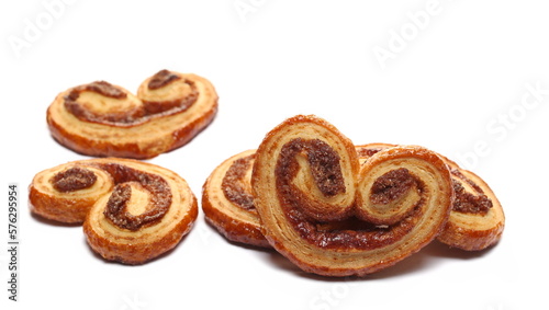 Puff pastry with butter and cinnamon isolated on white, side view