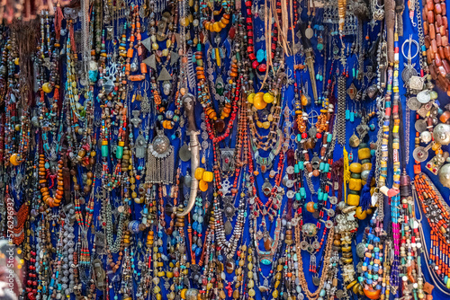 Necklaces and jewels of colored stones in a shop in a souk in the Medina in Marrakech