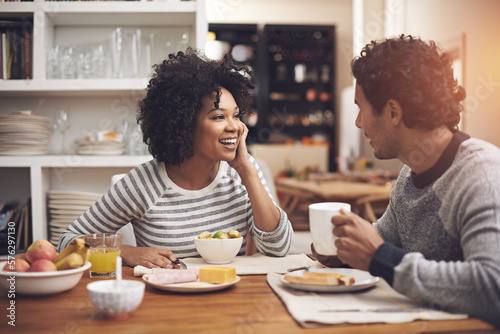 Enjoying a leisurely breakfast together. Shot of a couple eating breakfast together at home.