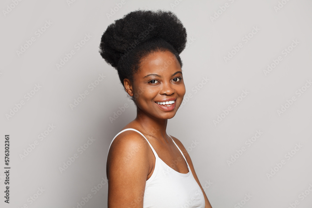 Women wellbeing. Attractive young woman with perfect clean fresh skin without make-up on white background