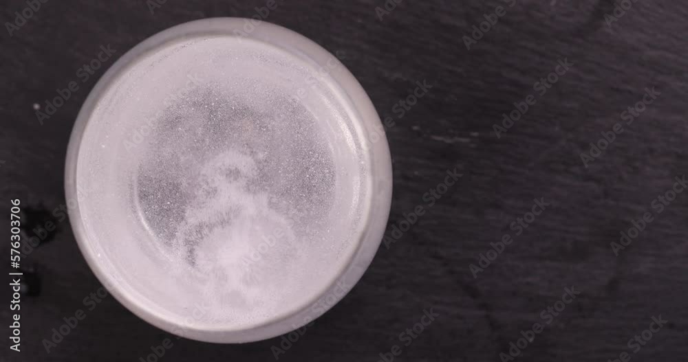 A tablet soluble in a glass of water, a large number of bubbles in the water from a tablet that is dissolved in water A tablet soluble in a glass of water, a large number of bubbles in the water from a tablet that is dissolved in water