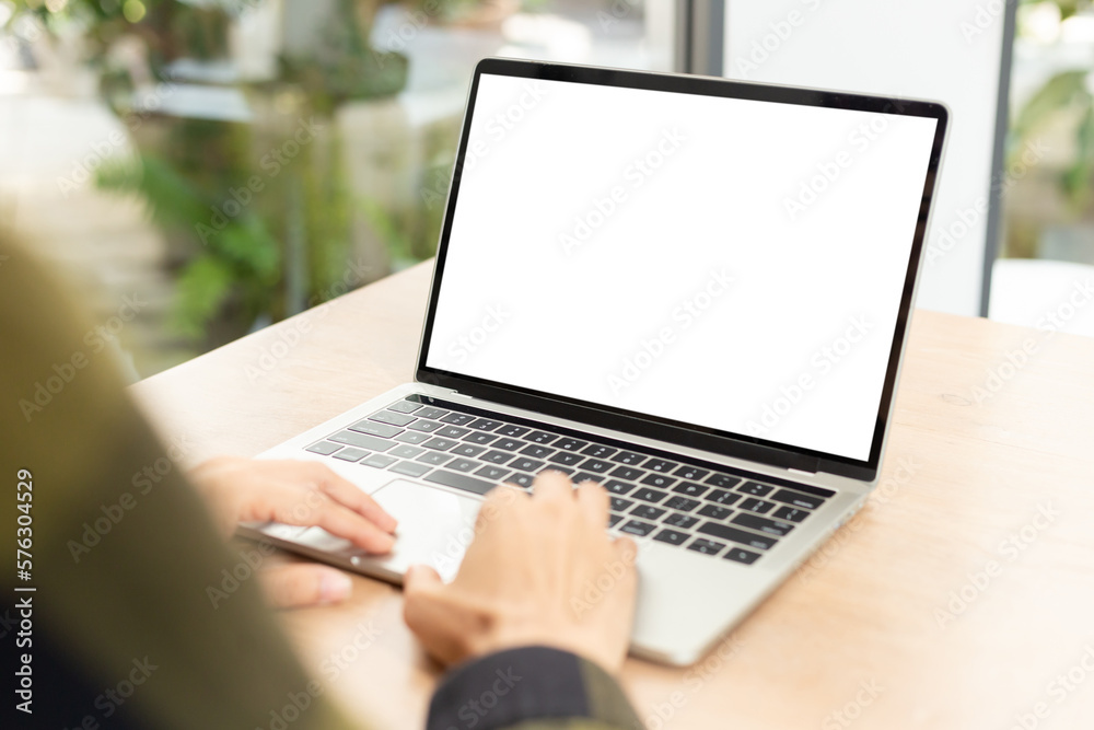 computer screen blank mockup.hand woman work using laptop with white background for advertising,contact business search information on desk at coffee shop.marketing and creative design computer screen blank mockup.hand woman work using laptop with white background for advertising,contact business search information on desk at coffee shop.marketing and creative design