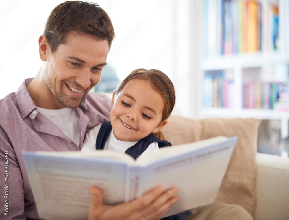 Reading her favourite story. A father reading a story. Reading her favourite story. A father reading a story.