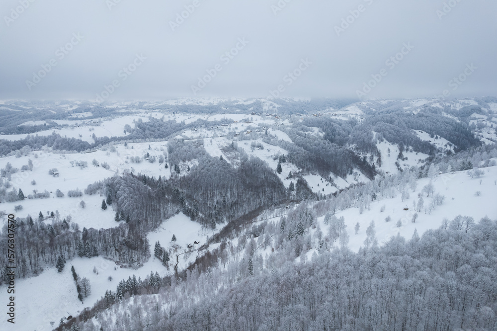 Winter landscape in rural Transylvania. Snowy scene in the Romanian mountains