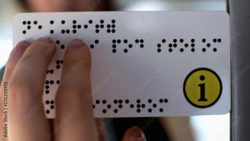 Fingers touching relief of points Braille text plate. Information for ...