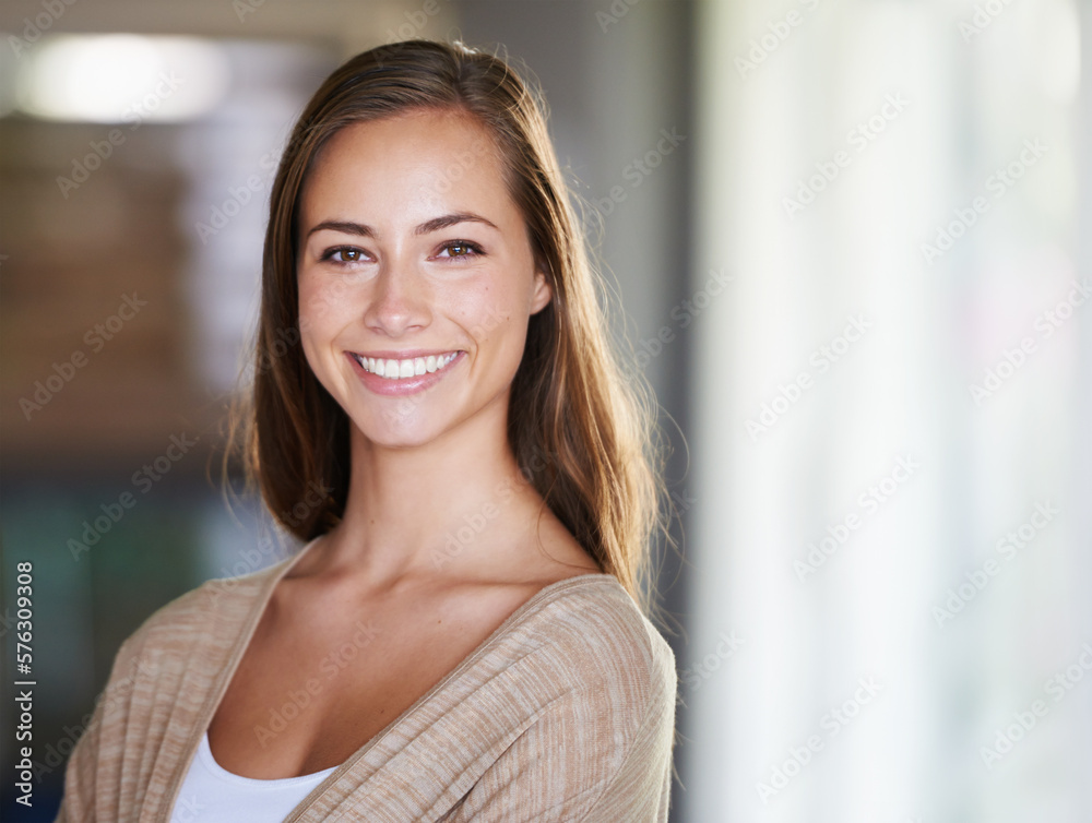 Keeping it natural and nonchalant. Shot of an attractive young woman relaxing at home.