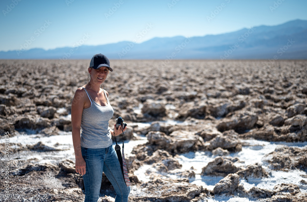 Portrait of a young girl in the hot desert desert landscape in dead valley Badwater Basin