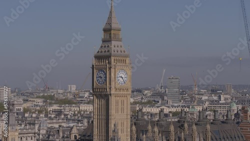 Aerial drone telephoto close up shot of Big Ben with London city in the background