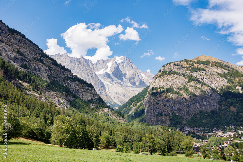 Mountain Range of the Italian Alps on a Sunny Summer Day- view of Glacier, Green Vegetation and Blue Sky