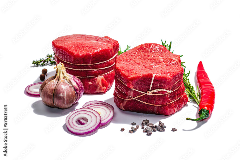 Raw Ribeye steak with spices and herbs isolated on white background. Trendy hard light, dark shadow Raw Ribeye steak with spices and herbs isolated on white background. Trendy hard light, dark shadow