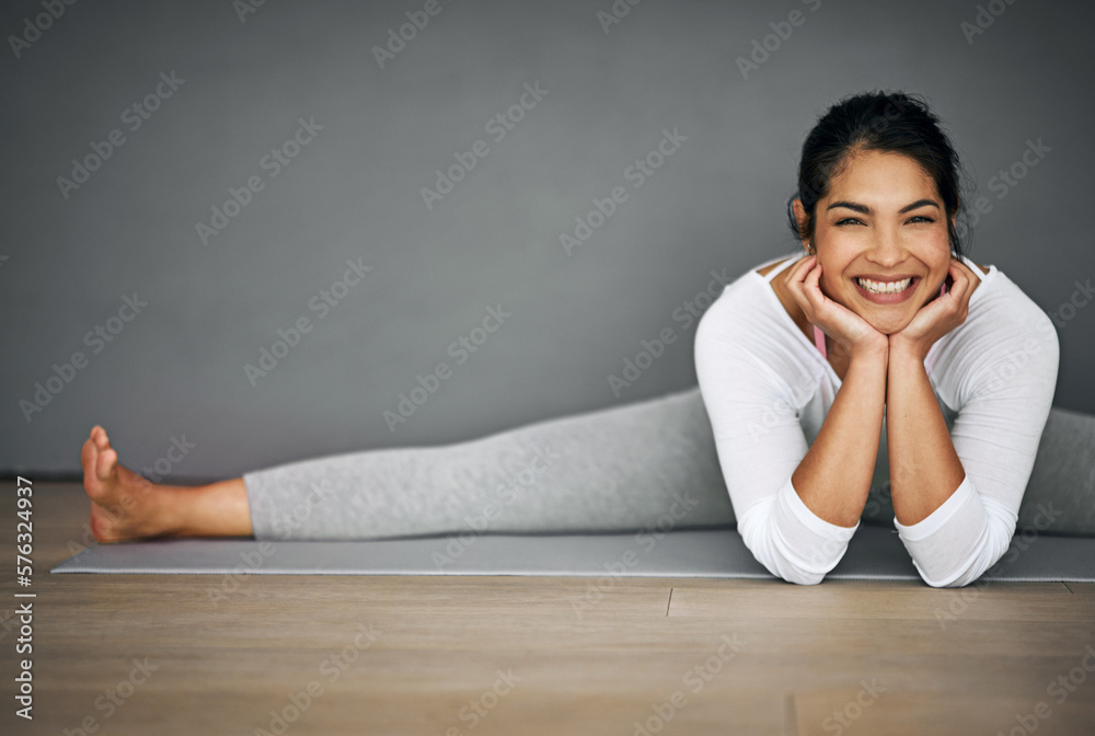 Yoga put this smile on my face. Portrait of an attractive young woman doing the splits in her yoga routine. Yoga put this smile on my face. Portrait of an attractive young woman doing the splits in her yoga routine.