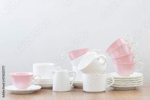 group of different cups on wooden table on white background
