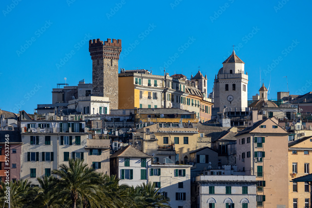 Close up view of buildings in the historic center of Genoa with Embriaci's tower, Italy