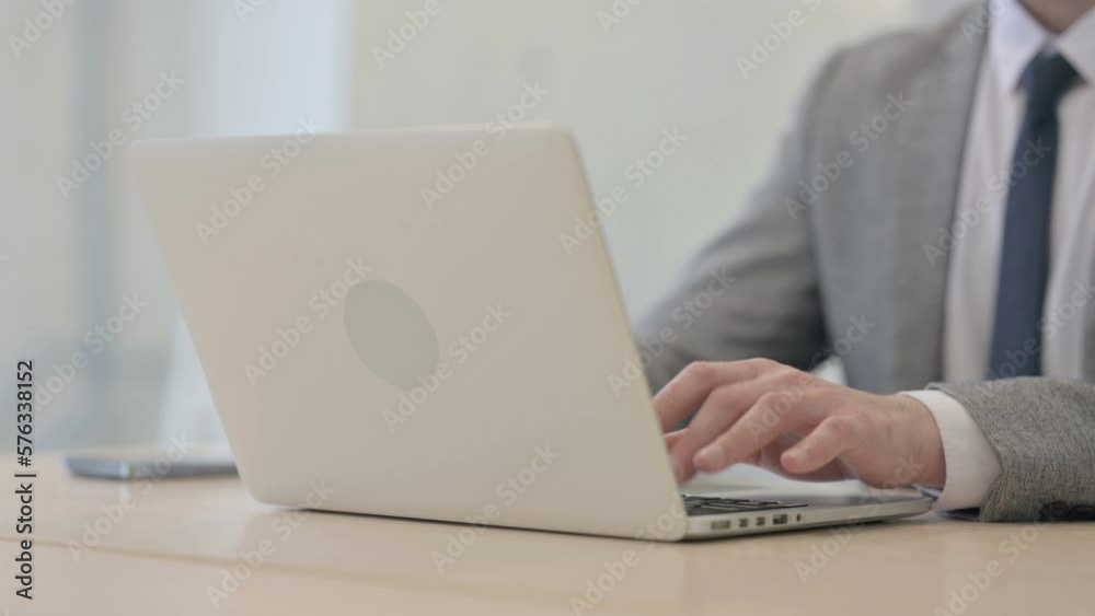 Close up of Young Businessman Typing on Laptop Close up of Young Businessman Typing on Laptop