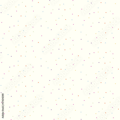 Seamless pattern of brightly coloured tiny polka dots scattered over a cream background.
