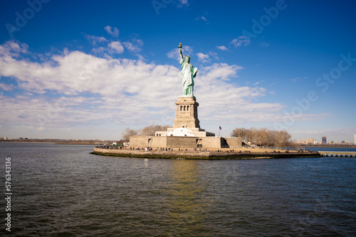 Statue of Liberty on a synny day with blue sky