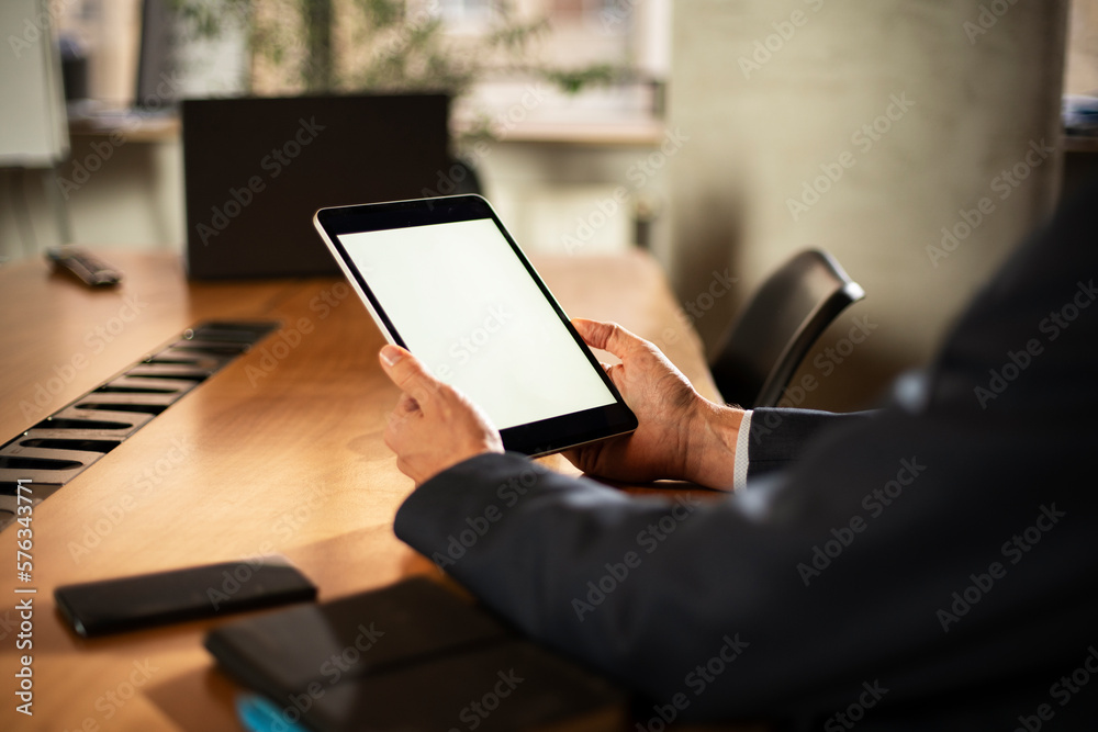 Close up of man using digital tablet. Close up of man using digital tablet.