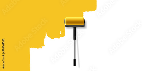 Paint roller with a long handle paints the wall yellow. For the design of home renovation and repair concepts, design ideas.