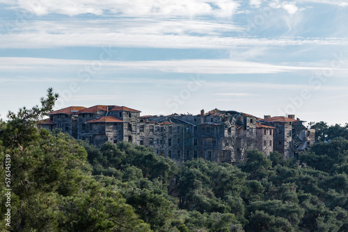 A crumbling wooden building on top of a hill on Adalar Island in Istanbul.
